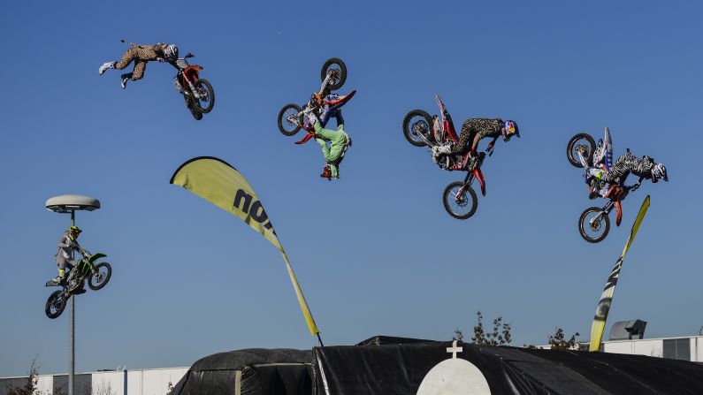 Motocross riders catch some air during the annual Milan Motorcycle Show, which was held in Milan, Italy, from November 8-13.