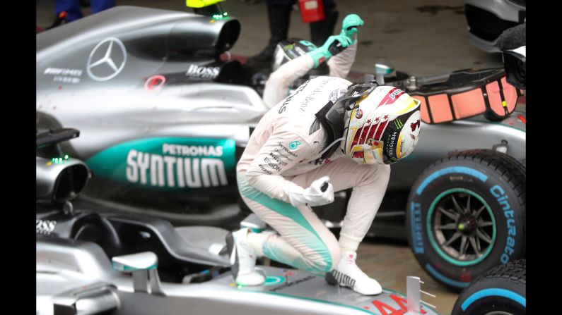 Formula One driver Lewis Hamilton celebrates on his car after <a href="index.php?page=&url=http%3A%2F%2Fwww.cnn.com%2F2016%2F11%2F13%2Fmotorsport%2Fbrazilian-gp-rain-hamilton-rosberg%2Findex.html" target="_blank">winning the Brazilian Grand Prix</a> on Sunday, November 13. Last year's champion is now just 12 points behind leader Nico Rosberg going into the final race of the season.