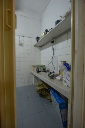 Tenants share a basic kitchen and bathroom.