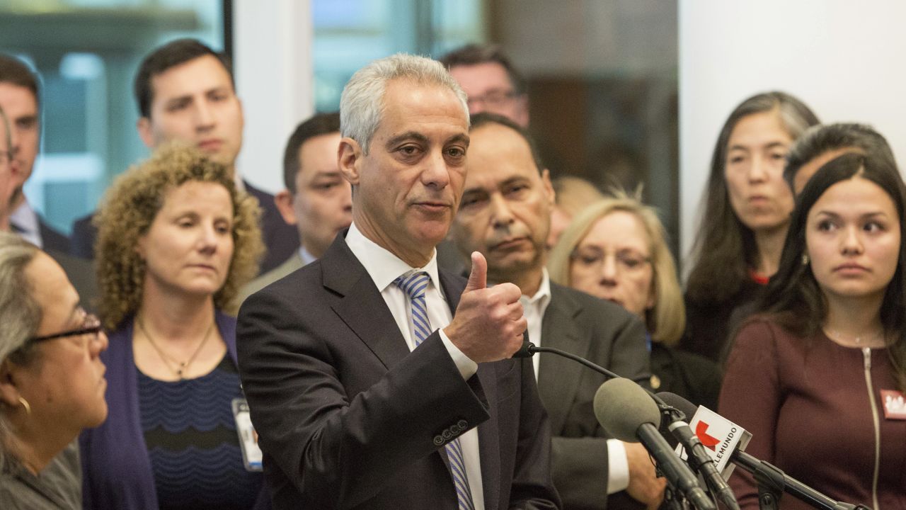 Chicago Mayor Rahm Emanuel, center, says the outcome of the presidential election will not affect Chicago's commitment as a sanctuary city.