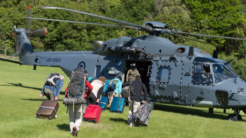 The New Zealand Defence Force conducts airlifts to evacuate people trapped in the area of Kaikoura after landslides cut off roads to the town.