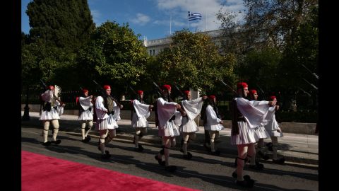 Greek presidential guards parade outside the presidential mansion in Athens on November 15.