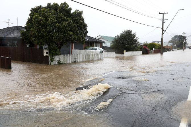 A cracked street is flooded in the area of Petone, near Wellington, after severe weather impacted the region in the aftermath of the quake on November 15. Two people were killed in the quake, which was followed by more than 1,000 aftershocks.