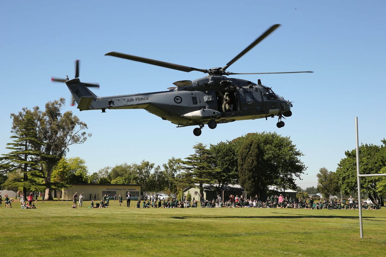 Tourists evacuated from Kaikoura arrive by helicopter at Woodend School grounds in Christchurch on November 15. People were evacuated from Kaikoura by air, after landslides triggered by the earthquake cut off road access to the popular tourist destination.