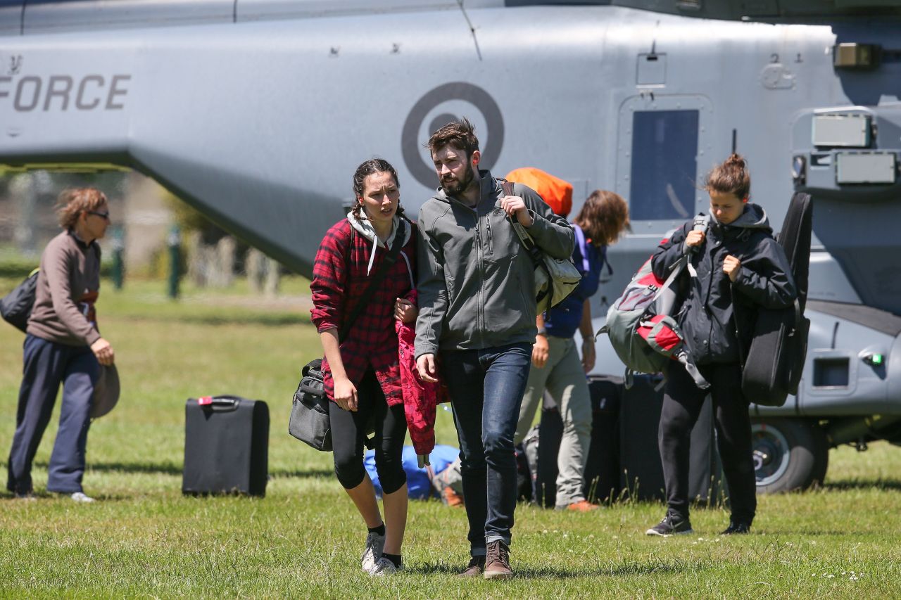 Tourists who had been visiting Kaikoura disembark from a military helicopter in Christchurch on November 15.