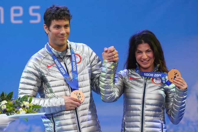 Danelle lost all useable vision in her right eye at 13, and at 27, she lost central vision in her left eye. Pictured here, Danelle and Rob with their bronze medals at the Sochi 2014 Paralympic Winter Games.