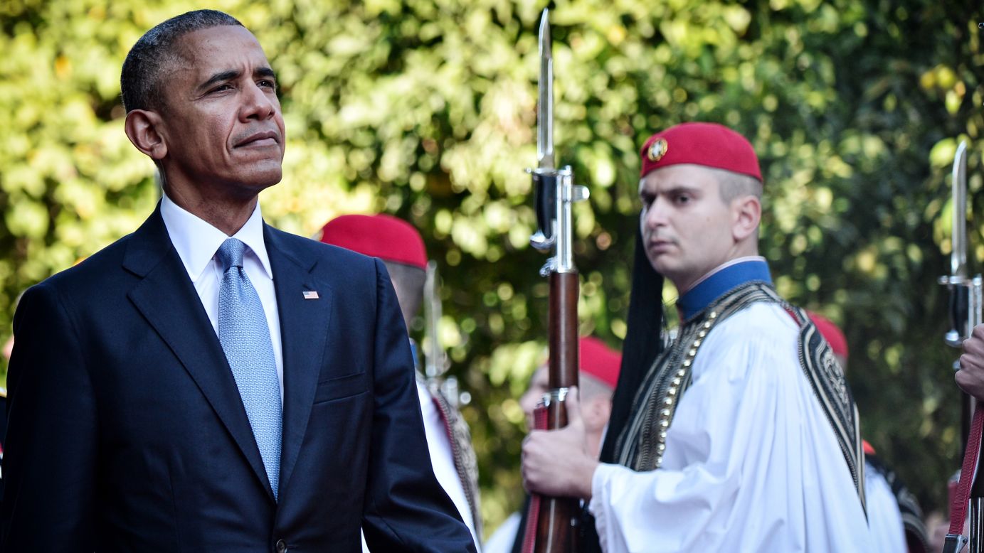 Obama reviews a presidential honor guard during an official welcoming ceremony in Athens on November 15.
