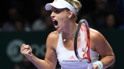 Angelique Kerber of Germany celebrates a point against Dominika Cibulkova of Slovakia during their women's singles final match at the WTA Finals tennis tournament in Singapore on October 30, 2016. / AFP / ROSLAN RAHMAN        (Photo credit should read ROSLAN RAHMAN/AFP/Getty Images)