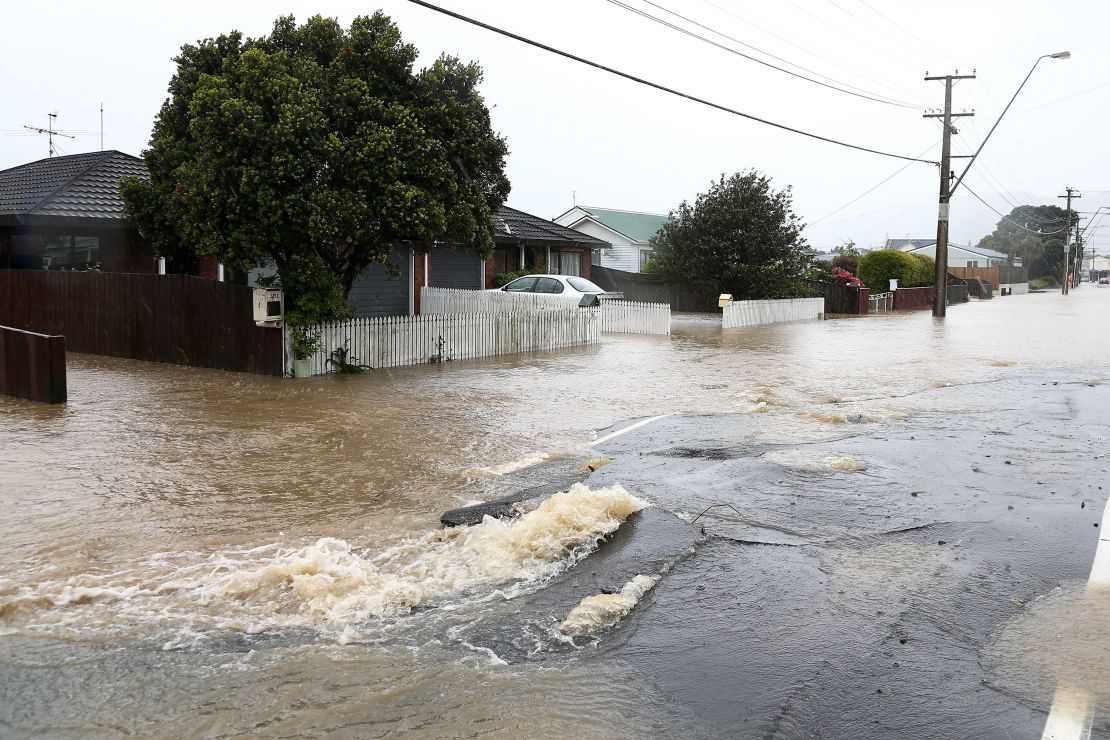 Flood water flows through cracks in the road surface on Udy Street after severe weather, November 15, 2016 in Wellington.