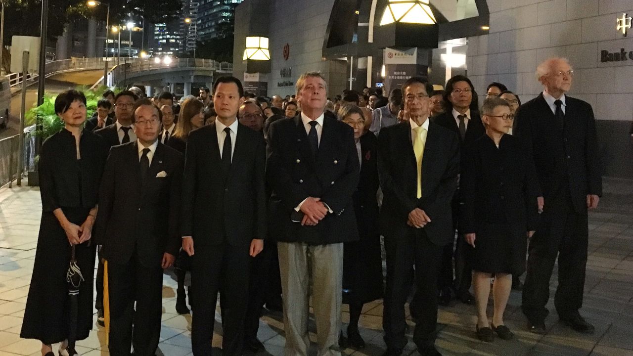 Hundreds of lawyers stage a silent march in protest against the Chinese government's action.