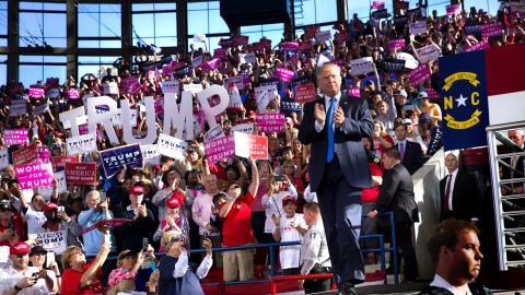 Trump receives a rousing ovation as he walks onto the stage in Raleigh, North Carolina, one day before the election. 