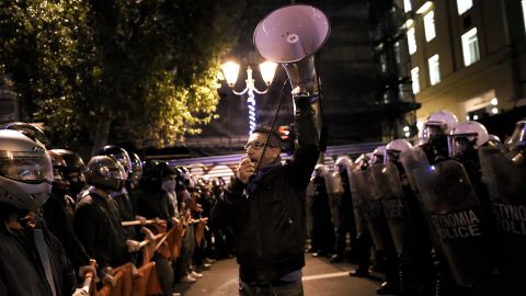 Police face off against demonstrators Tuesday during an anti-capitalist protest in Athens.
