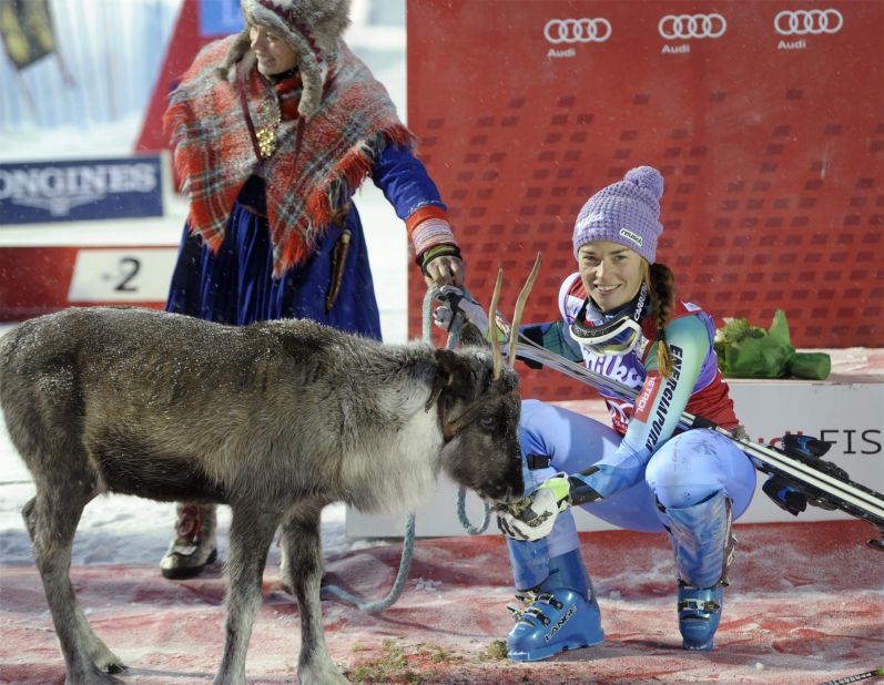 Slovenia's Tina Maze meets her reindeer, Viktor, after winning in 2014. Maze retired from professional skiing earlier this season. 