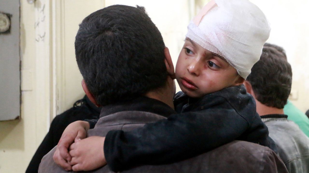 A boy receives medical treatment after being injured in an airstrike Tuesday. 
