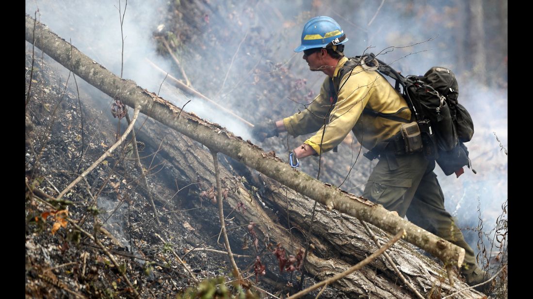 Firefighter Kevin Zimmer works the wildfire in Clayton on November 15.