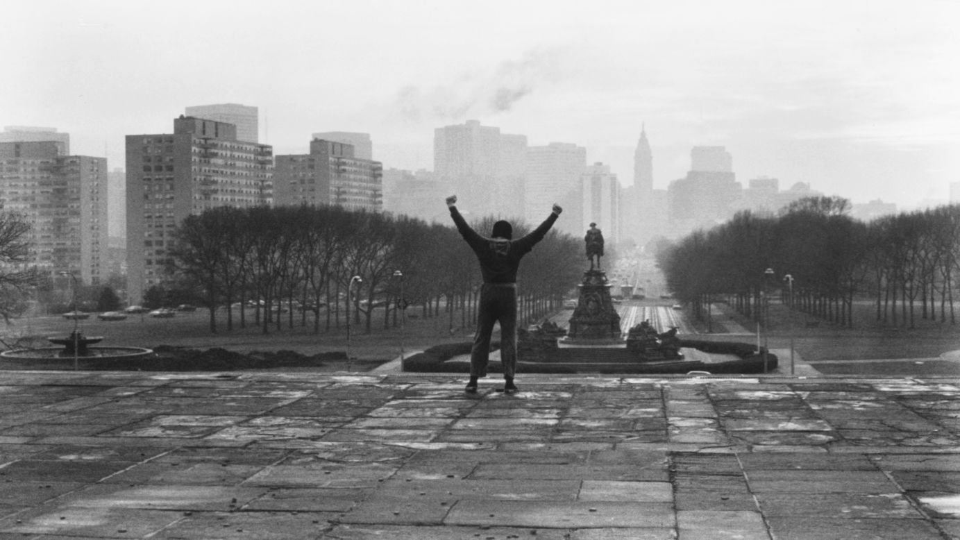In this iconic scene from the 1976 film "Rocky," the title character triumphantly raises his arms after climbing the steps of the Philadelphia Museum of Art. The small-budget film, made for just a little more than $1 million, premiered on November 21, 1976, and went on to become the year's biggest box-office hit. It won three Academy Awards, including Best Picture, and it made lead actor Sylvester Stallone an overnight star. Forty years later it remains one of the greatest sports movies of all time, spawning six sequels -- the most recent being "Creed" in 2015.