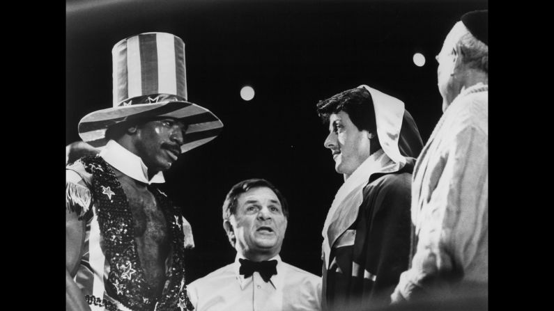 Rocky and Apollo face off before their big fight. The country was celebrating its bicentennial that year, hence the champ's Uncle Sam outfit and the fact that the fight was held in Philadelphia, where the Declaration of Independence was signed.