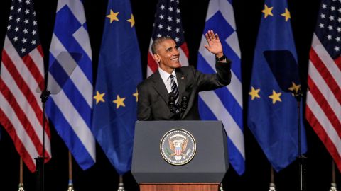 Obama waves to the crowd after delivering a speech at the Stavros Niarchos Foundation in Athens, Greece, on November 16.