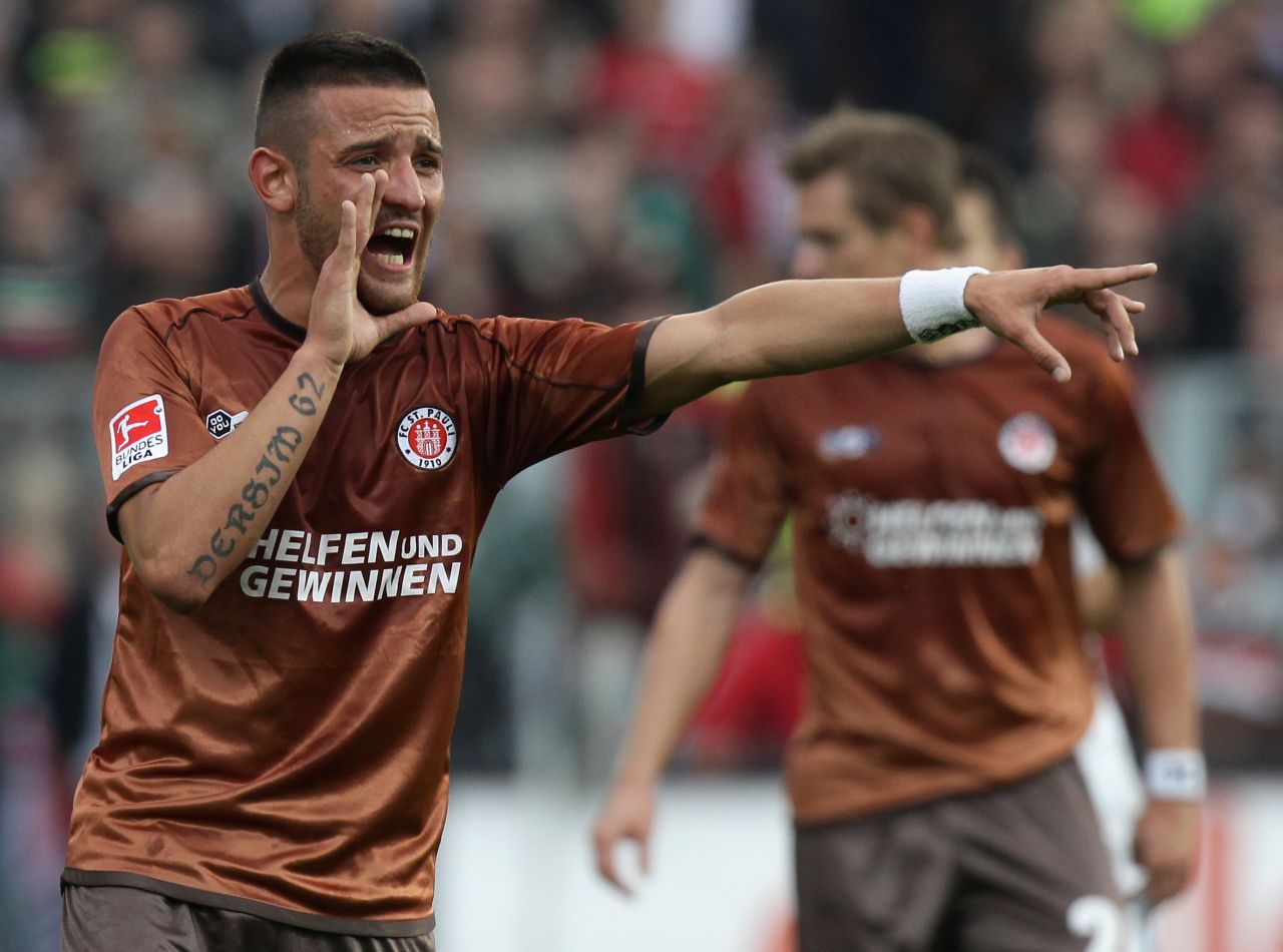 German footballer Deniz Naki -- shown playing for former club St. Pauli of the Bundesliga -- was banned for 12 matches and fined $5,825 for a Facebook post dedicating his Turkish second division club's victory to Kurdish combatants in southeastern Turkey. Naki's parents are of Kurdish origin, and he has Kurdish-themed tattoos on his arms. 