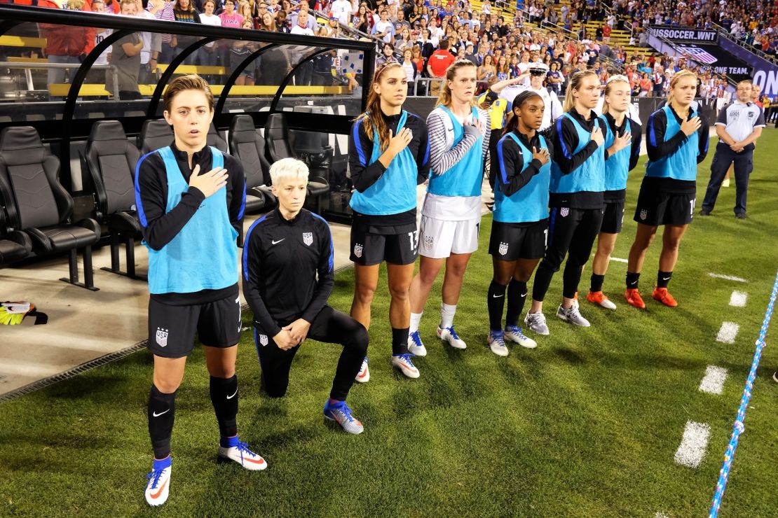 Megan Rapinoe of the US  Women's team kneels during the playing of the national anthem. 