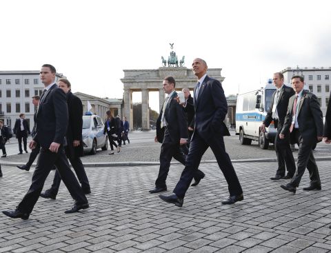 Obama walks past the Brandenburg Gate after visiting the US Embassy in Berlin on November 17.