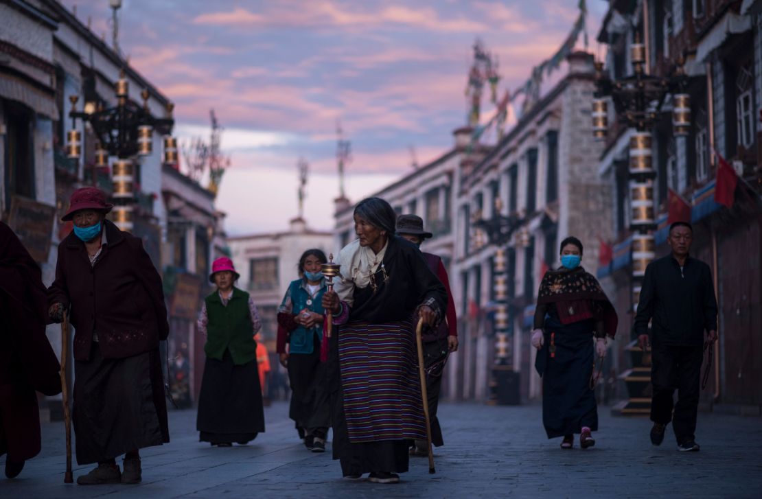 Pilgrims walking and praying near the Jokhang Temple in Lhasa, in September.