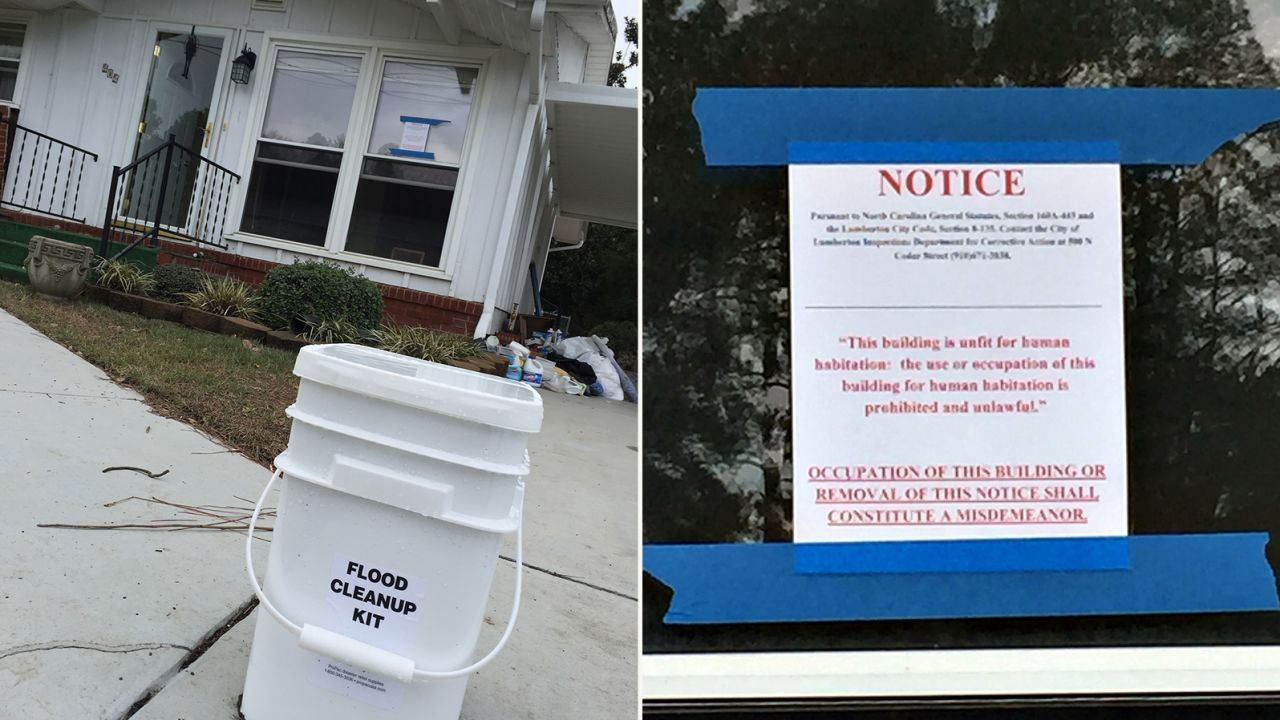 The state has left cleanup kits in driveways, but the signs on a damaged house say habitation is illegal.