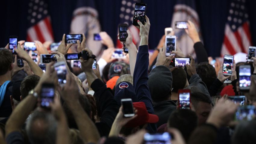 MANASSAS, VA - DECEMBER 02:  Supporters hold up their phone cameras as they wait for the arrival of Republican presidential candidate Donald Trump at a campaign rally December 2, 2015 in Manassas, Virginia. Trump continued to campaign for the Republican nomination for U.S. President.  (Photo by Alex Wong/Getty Images)