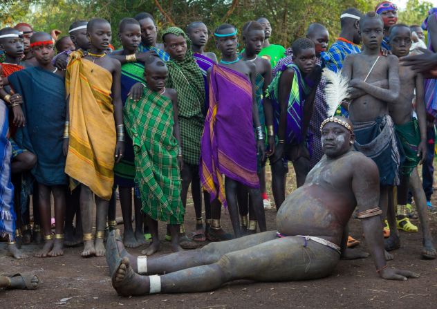Every June or July in the Omo Valley, Ethiopia, the <em>Ka'el</em> -- the Bodi lunar new year -- takes place. With it comes an extraordinary show of pageantry. In the months before the event men live in isolation and drink to excess <a href="index.php?page=&url=https%3A%2F%2Fwww.cnn.com%2F2015%2F10%2F02%2Fafrica%2Fmilk-big-business-africa%2Findex.html" target="_blank">a mixture of cow milk and cow blood</a> for months in order to become vastly bloated and overweight. Each clan will then present an unmarried male to compete for the title of fattest man -- and with the glory, the greater chance of finding a wife. With stomachs swollen, balance and fatigue can be an issue, but once the event is over, contestants return to their normal size in a matter of weeks. 