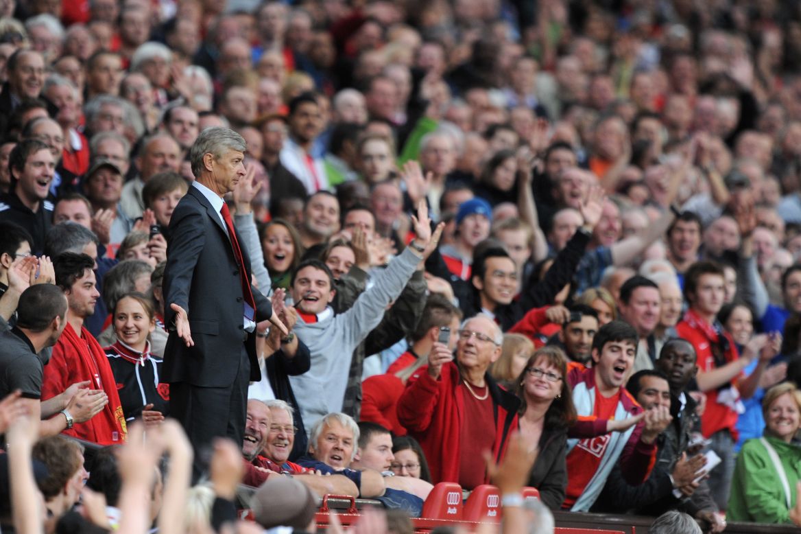 The 2009 clash at Old Trafford created one of the most iconic images of this rivalry. Sent off by referee Mike Dean, Wenger makes his way to the stands behind the dugout. Without an obvious place to go, the Frenchman holds his arms out in Dean's direction, much to the delight of the United fans around him.