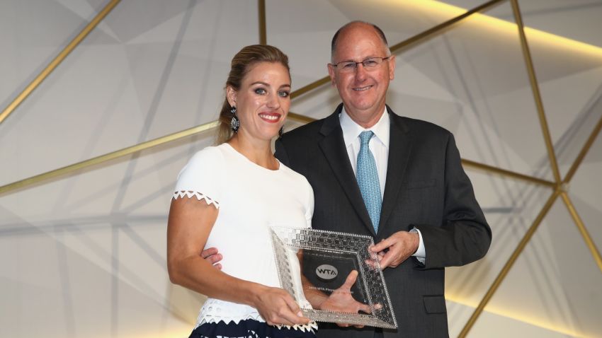 SINGAPORE - OCTOBER 21:  Angelique Kerber of Germany receives the 2016 Player of the Year Award from Steve Simon, WTA CEO during the Gala Dinner prior to the BNP Paribas WTA Finals Singapore at Marina Bay Sands on October 21, 2016 in Singapore.  (Photo by Julian Finney/Getty Images)
