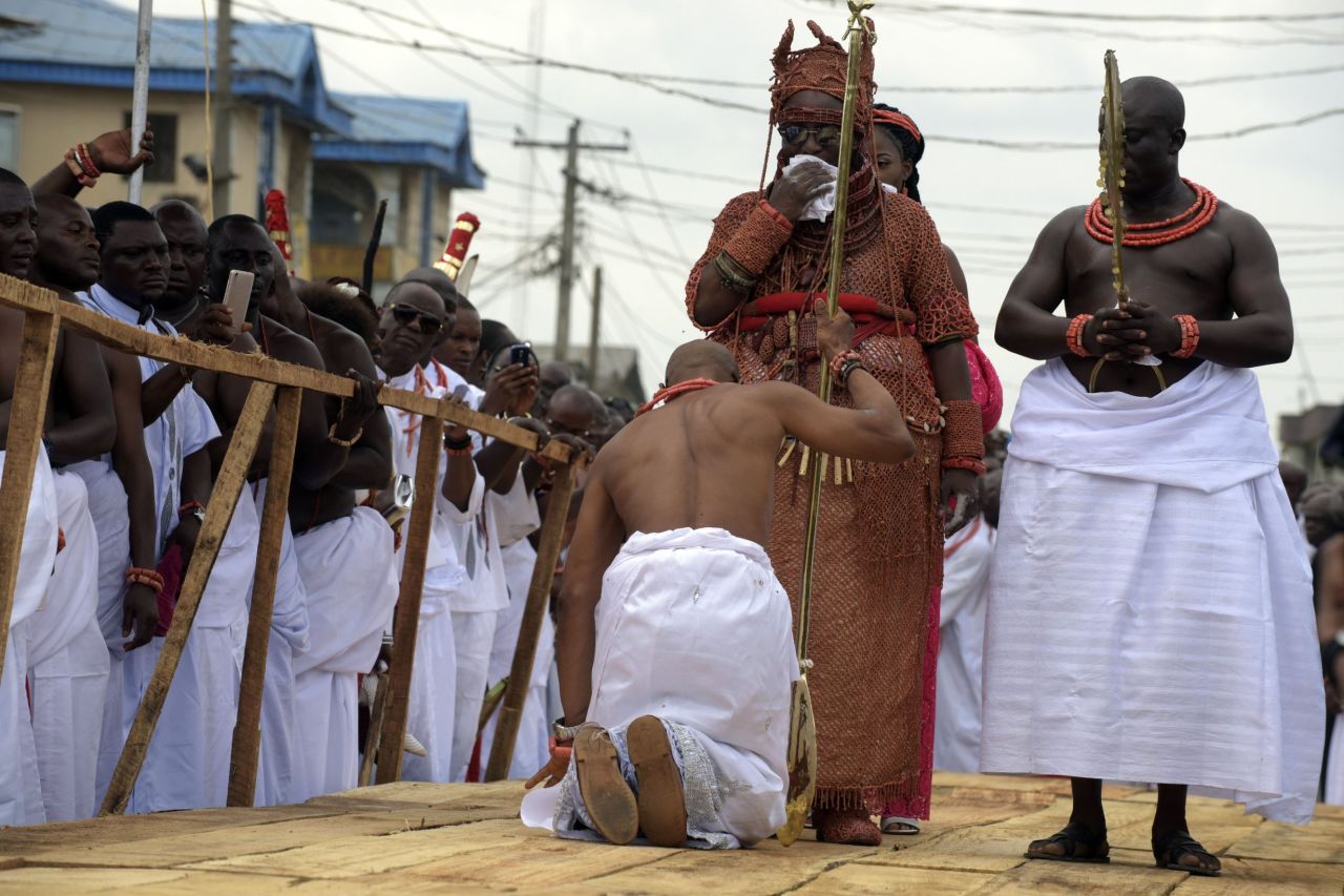 A palace aide kneels down before newly crowned Monarch. Kingship as an institution is much more than a ceremony hence the kingdom's strict and largely uncompromising adherence to ancient customs and traditions.