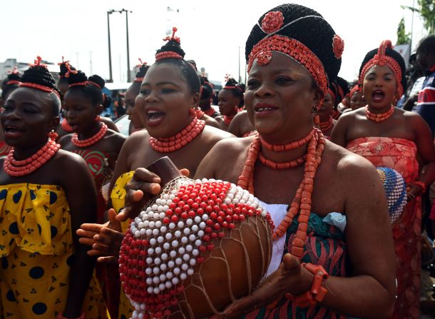 Dancers perform during the ceremony. In the final part of the journey the king is led to the ancient town of Isekhere. 