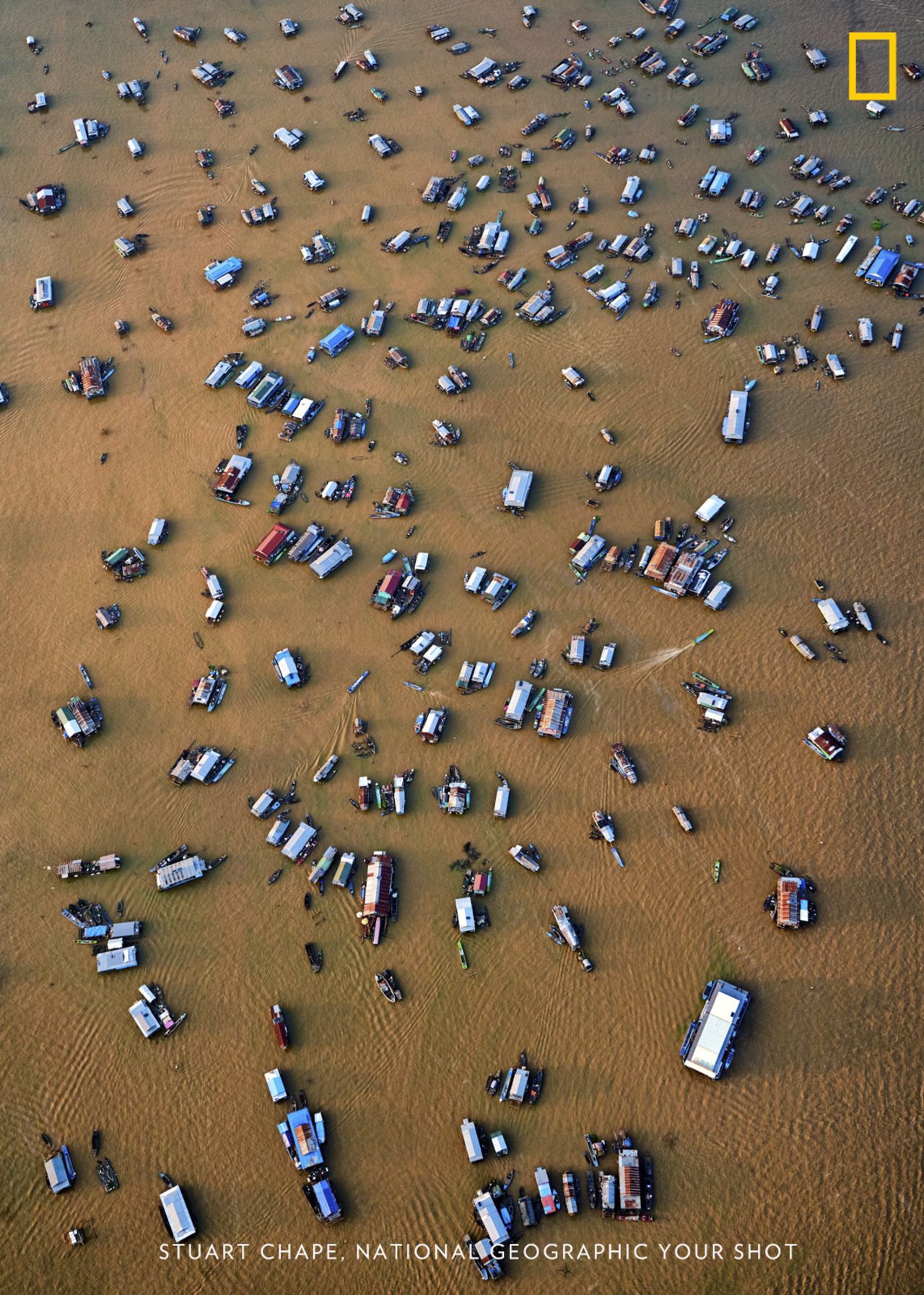 Photo: Stuart Chape, Samoa: "This aerial view of the Chong Kneas floating village on Tonle Sap lake, Cambodia, demonstrates just how threatened the great lake is from changing rainfall patterns and rising temperatures."<em> </em><em>Via National Geographic Your Shot</em>