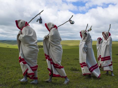 In Eastern Cape, South Africa, young Xhosa men take part in a coming of age initiation called<em> Ulwaluko</em>. The youths, known as <em>abakhwetha</em>, are first circumcised without anesthetic, before being sent away from their village and into the bush, with minimal supplies and wrapped in a blanket. Wearing white clay on their faces, initiates will fend for themselves for up to two months, living in a structure built by the village's adult community specifically for<em> Ulwaluko</em>. Upon their return they are no longer referred to as "boy" and receive a new blanket. The initiation has not been without its criticisms, due to <a href="http://www.bbc.co.uk/news/world-africa-19256839" target="_blank" target="_blank">complications and malpractice</a> surrounding the circumcision process.