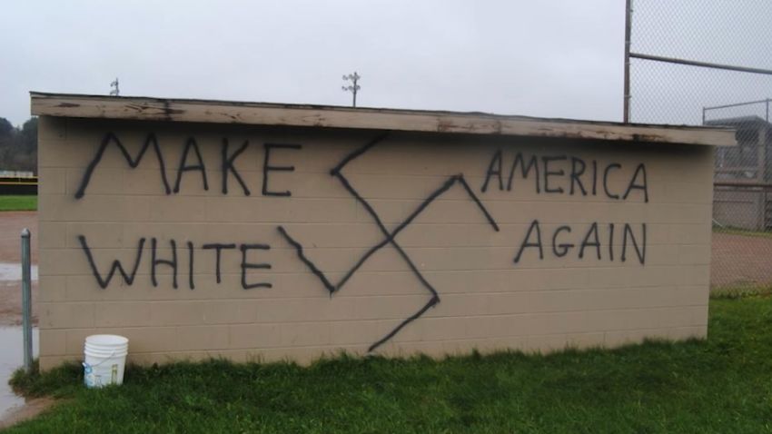 Someone painted "Make America White Again" on a dugout wall.