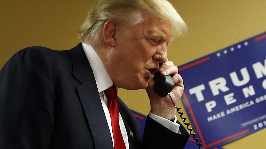 ASHEVILLE, NC - SEPTEMBER 12: Republican presidential candidate Donald Trump speaks to a caller on the other end of the phone line as volunteers man a phone bank prior to a rally on September 12, 2016 at U.S. Cellular Center in Asheville, North Carolina. Trump continues to campaign for his run for president of the United States.(Photo by Brian Blanco/Getty Images)