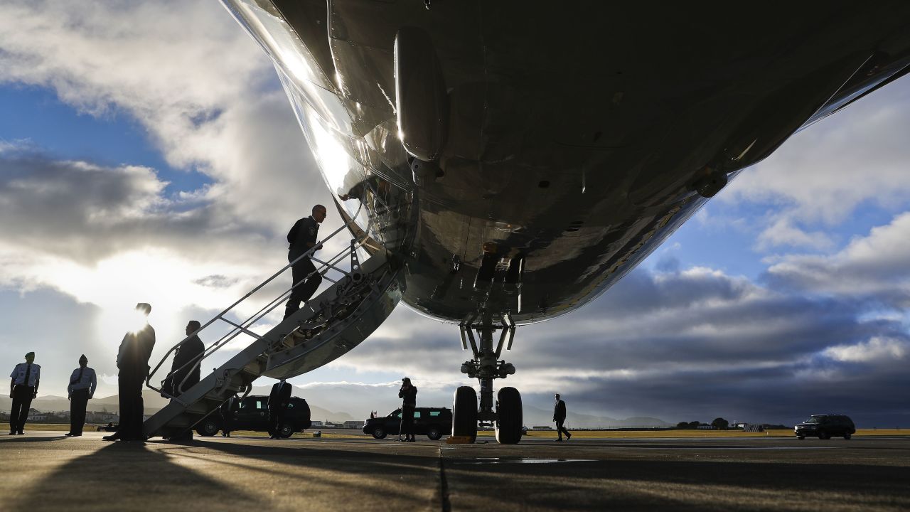 On his way to Peru, Obama boards Air Force One during a refueling stop in the Azores on November 18.