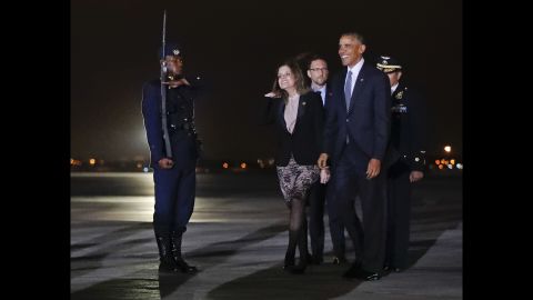 Mercedes Araoz, Peru's second vice president, joins Obama on the tarmac after his arrival at an airport near Lima on Friday, November 18.