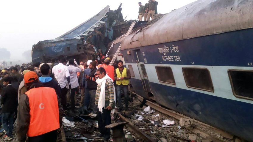 Indian rescue workers search for survivors in the wreckage of a train that derailed near Pukhrayan in Kanpur district on November 20, 2016.
A passenger train derailed in northern India on November 20, killing at least 63 travellers most of whom were sleeping when the fatal accident occurred, police said. Rescue workers rushed to the scene near Kanpur in Uttar Pradesh state where the Patna-Indore express train derailed in the early hours of the morning.
 / AFP / -        (Photo credit should read -/AFP/Getty Images)