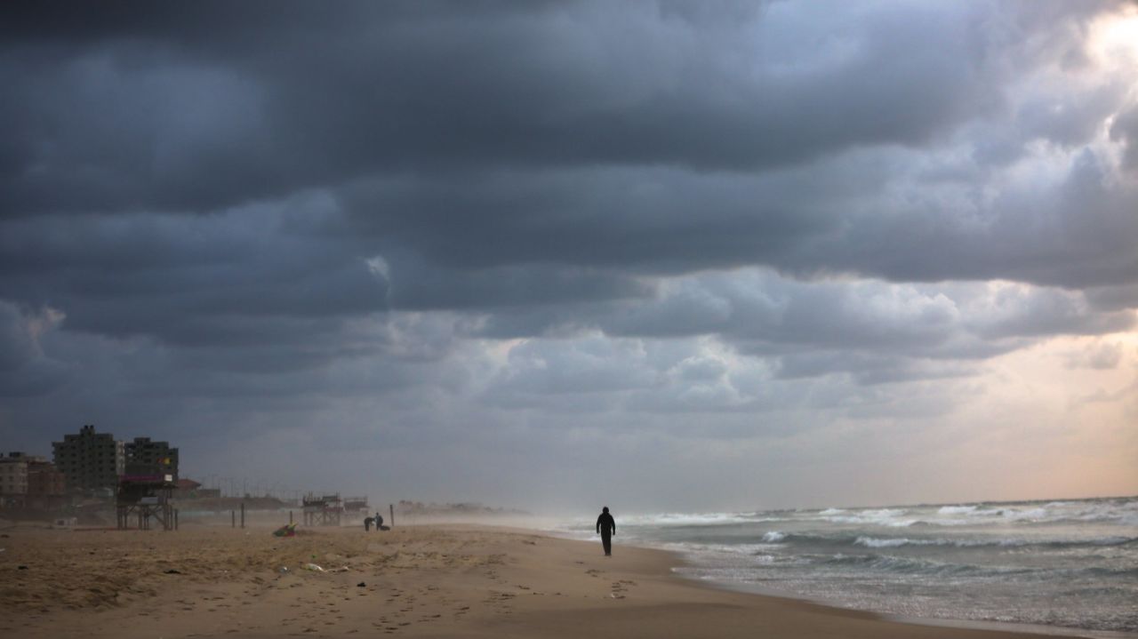 A lone figure is silhouetted against a brooding sky in Gaza. The war-torn territory is hoping to build a tourism industry that will make it a travel hub in the Middle East.
