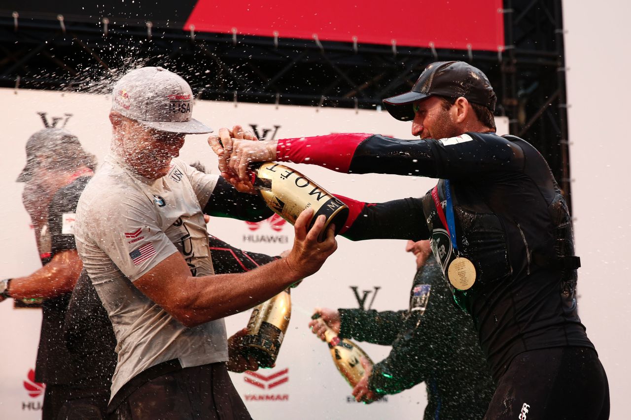 Ainslie of Land Rover BAR of Great Britain (R) celebrates his team's Louis Vuitton America's Cup World series Championship win in Fukuoka. Land Rover now takes the two bonus points into next year's America's Cup qualifiers in Bermuda.