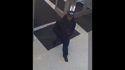 Police viewed surveillance footage as they searched for the suspect.