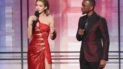 LOS ANGELES, CA - NOVEMBER 20:  Co-hosts Gigi Hadid (L) and Jay Pharoah speak onstage during the 2016 American Music Awards at Microsoft Theater on November 20, 2016 in Los Angeles, California.  (Photo by Kevin Winter/Getty Images)