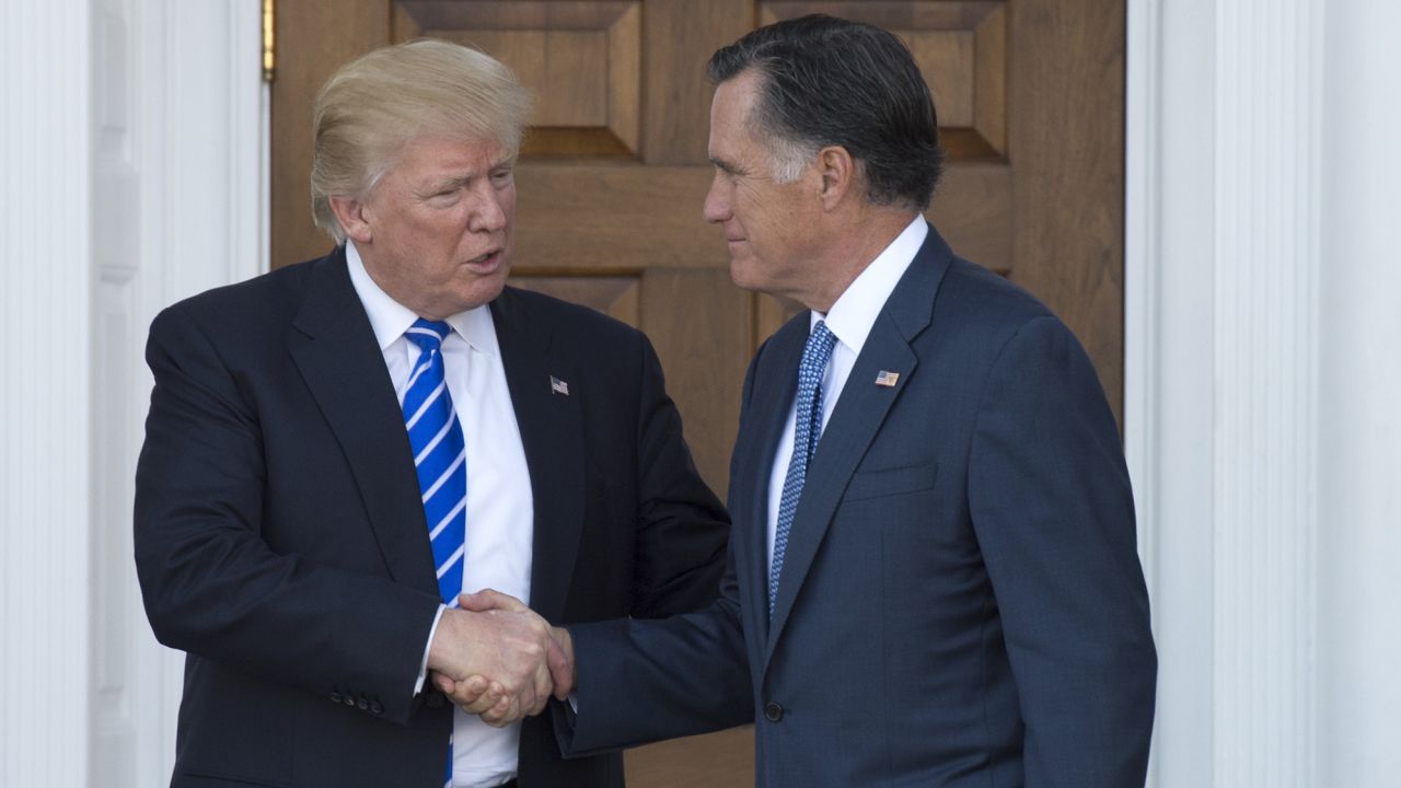 President-elect Donald Trump shakes hands with Mitt Romney after their meeting at the clubhouse of Trump National Golf Club on November 19, 2016 in Bedminster, New Jersey. 