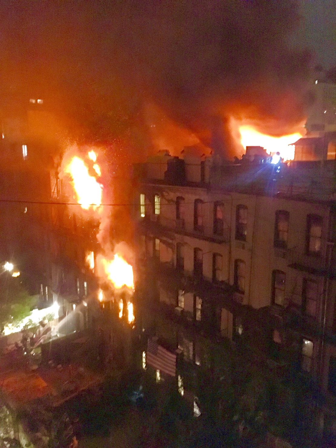 The blaze engulfed the five-story building.