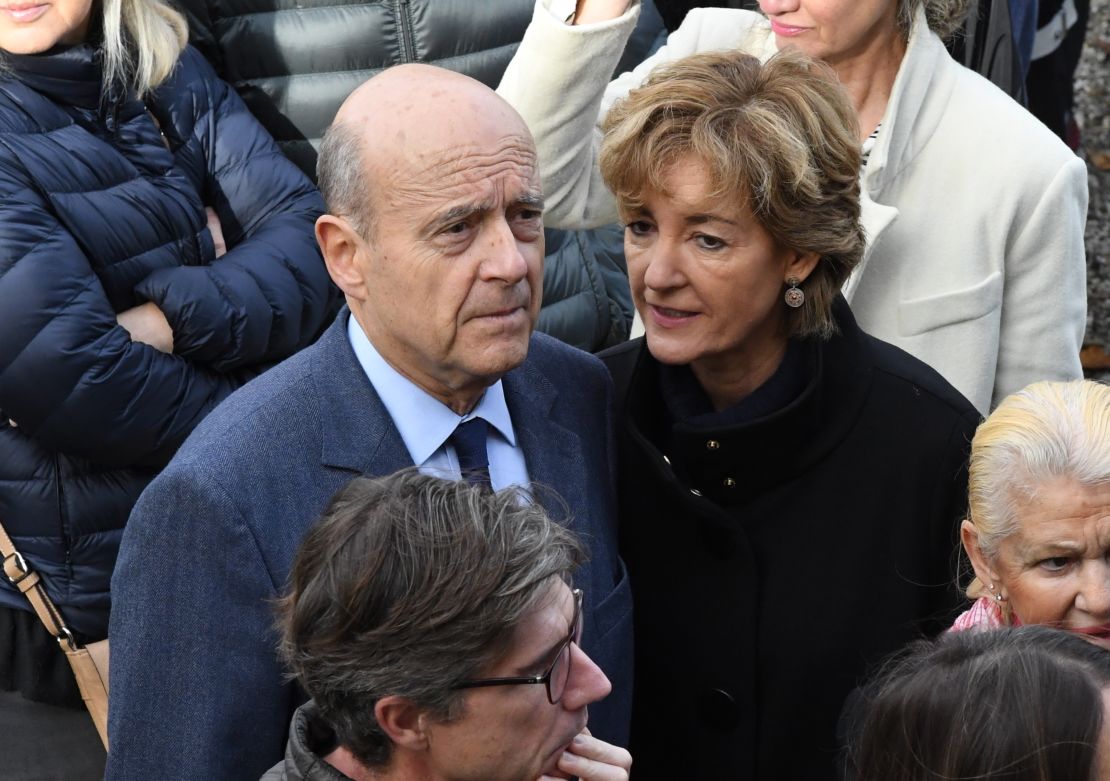 Alain Juppe with his wife Isabelle Juppe at a polling station in Bordeaux on November 20, 2016.