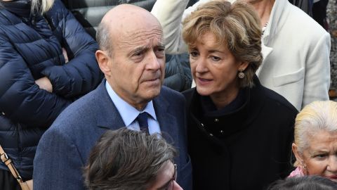 Alain Juppe with his wife Isabelle Juppe at a polling station in Bordeaux on November 20, 2016.
