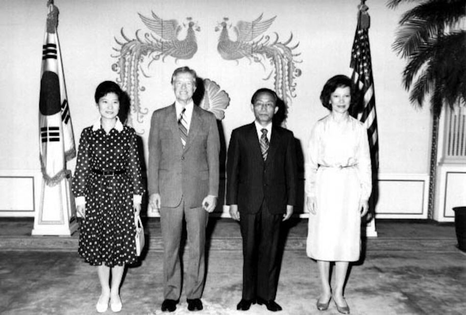 Park Geun-hye, left, stands next to US President Jimmy Carter during Carter's state visit to Seoul in 1979. After Park's mother was killed in a botched assassination attempt on her father in 1974, Park became regarded as South Korea's first lady.