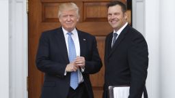 President-elect Donald Trump pauses pose for photographs as he greets Kansas Secretary of State, Kris Kobach, at the Trump National Golf Club Bedminster clubhouse, Sunday, Nov. 20, 2016, in Bedminster, N.J..